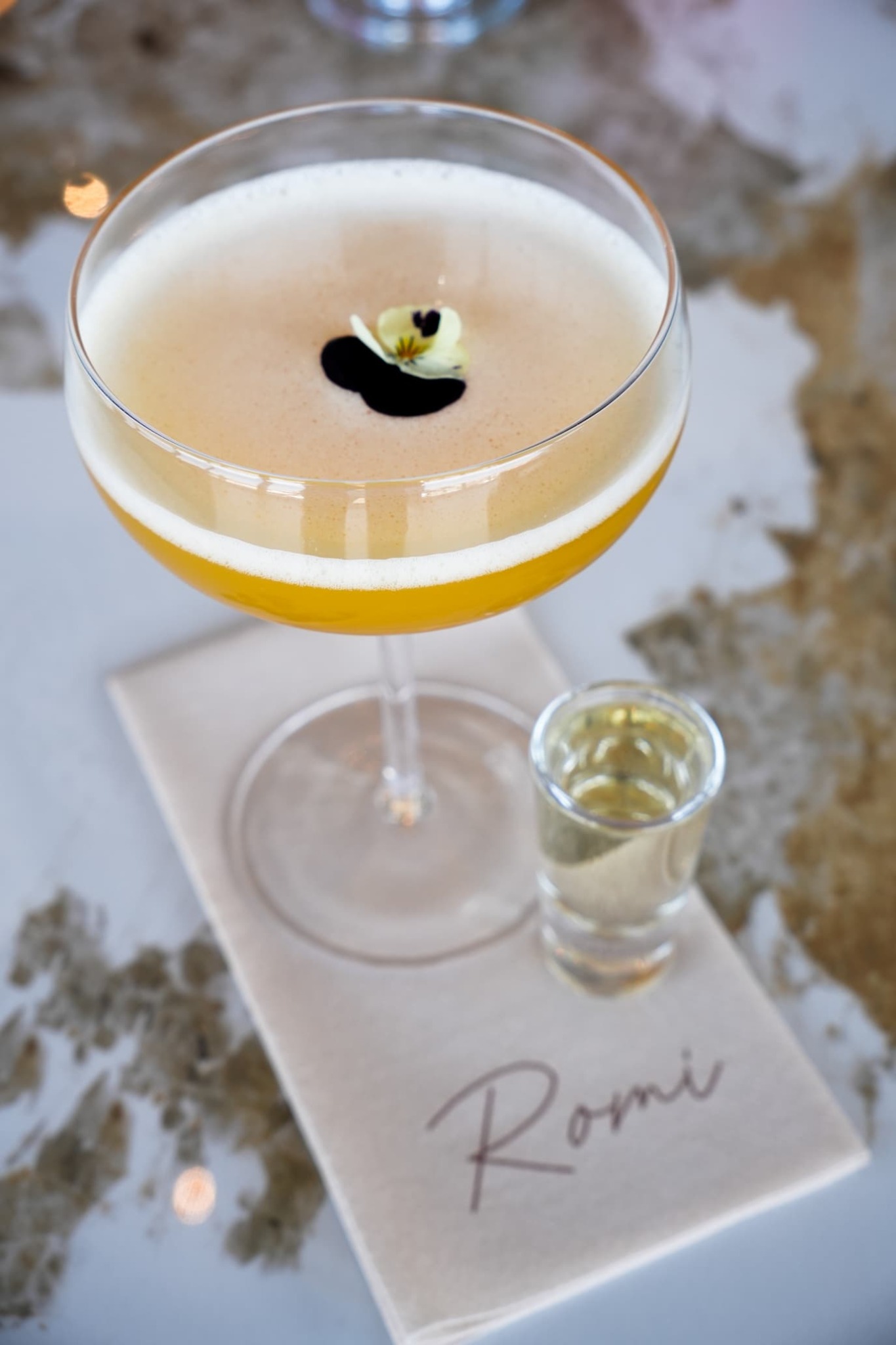 Signature cocktail on a Romi napkin
